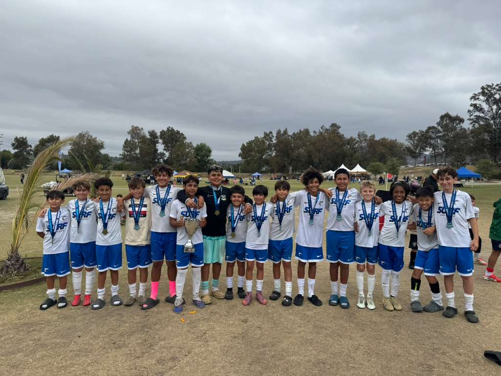 SD Surf U13 ECNL team holding the Rebels National Cup trophy